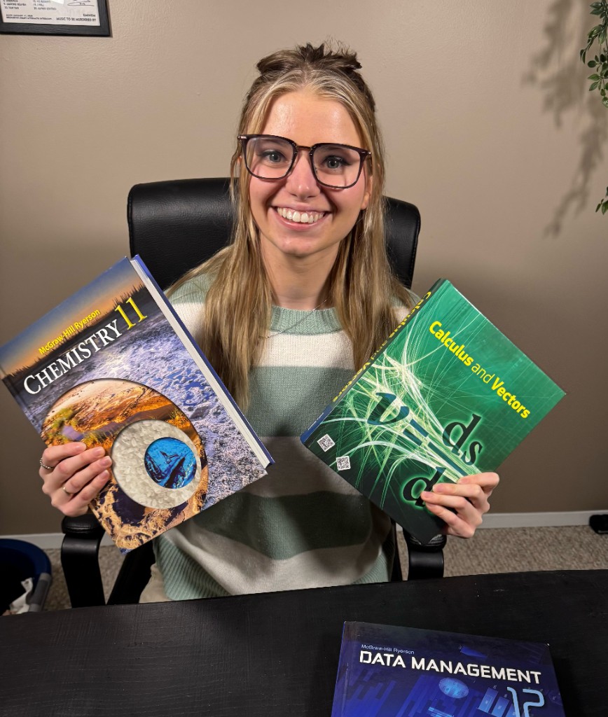 Olivia with mathematics and science textbooks